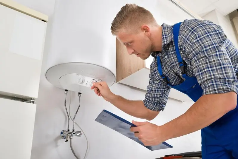 Worker adjusting temperature of water heater