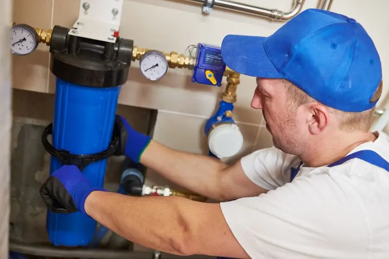 plumber Installing water filter into system