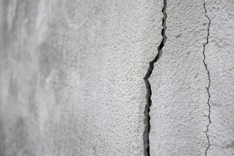 Old plaster wall with cracks
