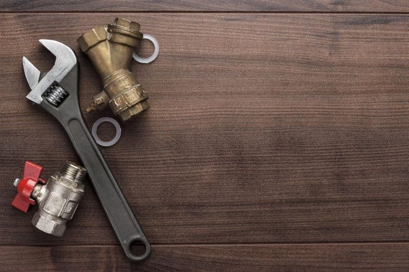 adjustable wrench and pipes