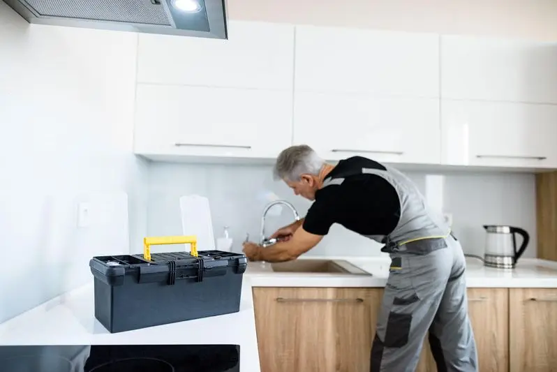 Plumber from Christianson Air Conditioning & Plumbing working on a sputtering faucet