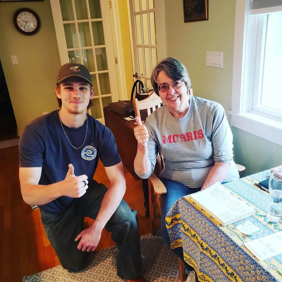 Xander with a happy plumbing customer