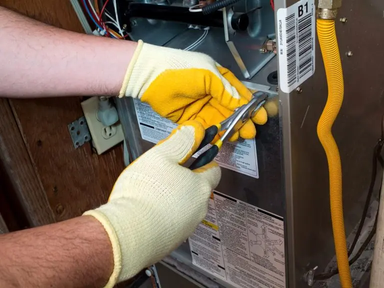 worker using gloves fixing furnace