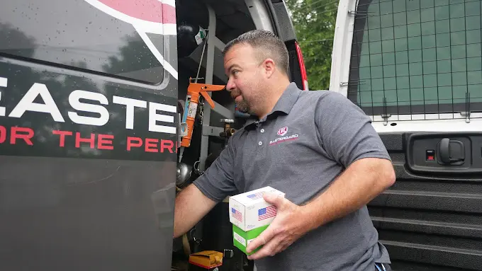 semi annual hvac maintenance eastergard worker taking tools out from a van