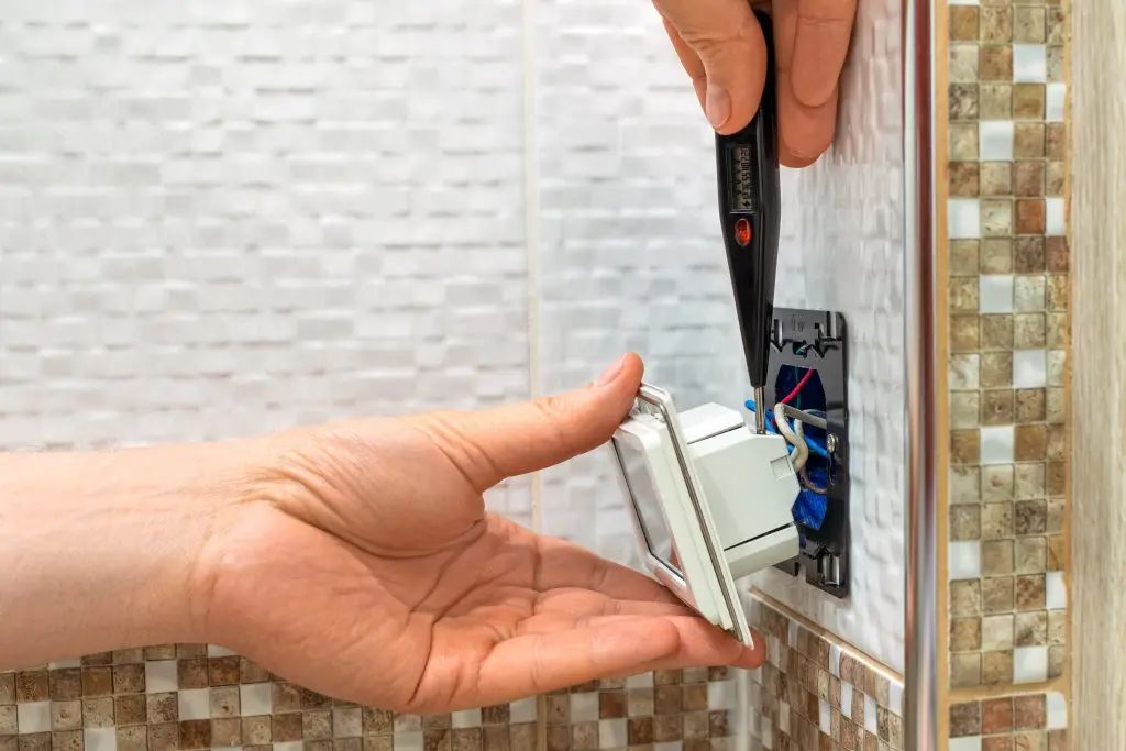 programmable thermostat installation hand using tool to instal