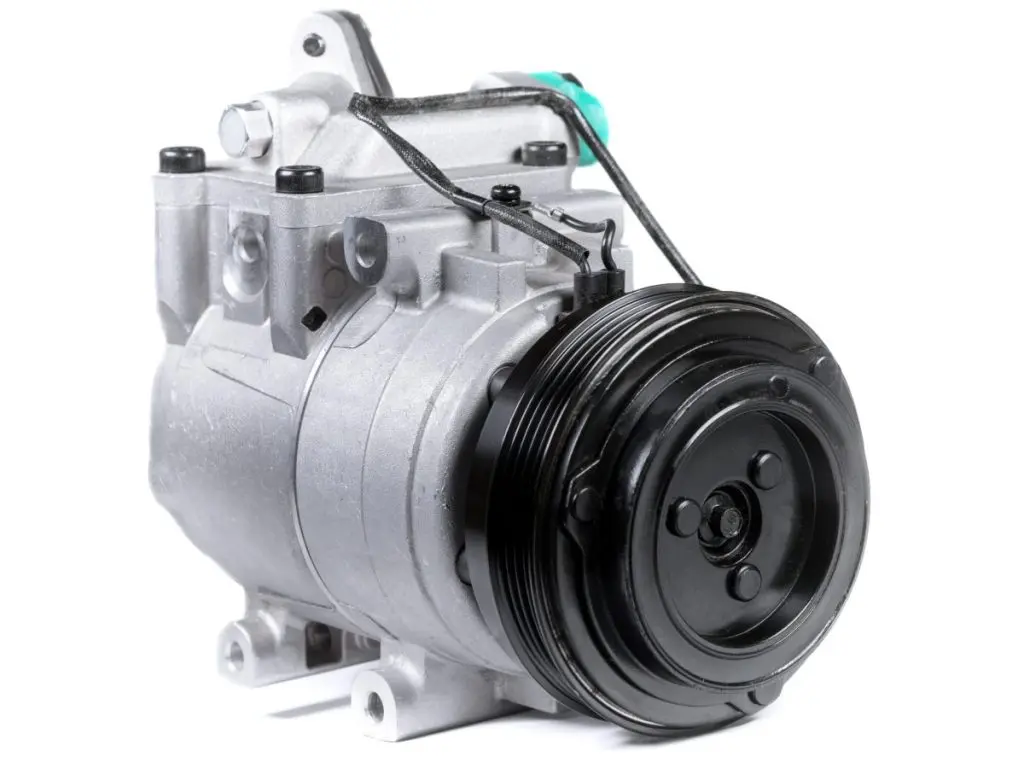 ac compressor replacement cost New car air conditioning AC compressor on isolated white background