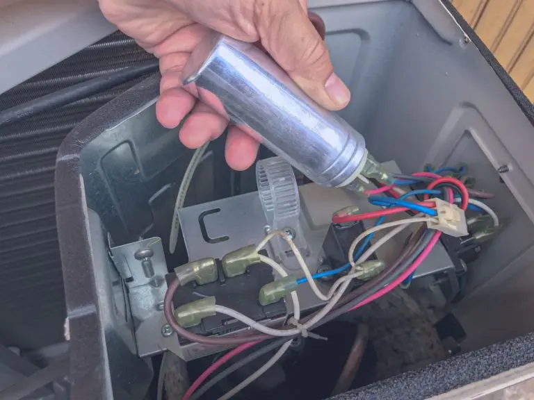 man holding ac capacitor