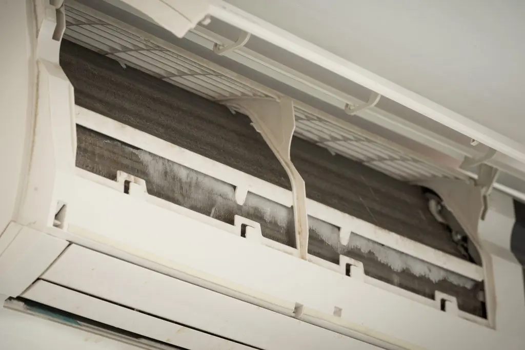 ac freezing up close up ice on coil cooler of dirty air conditioner