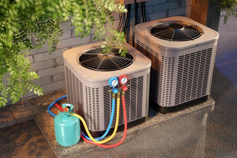 AC refrigerant HVAC maintenance with refrigerant gauges and gas cylinder connected to outdoor air conditioning units
