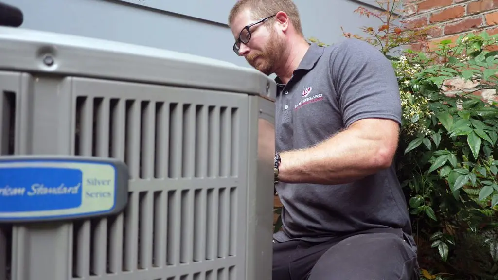 ac capacitor man installing unit