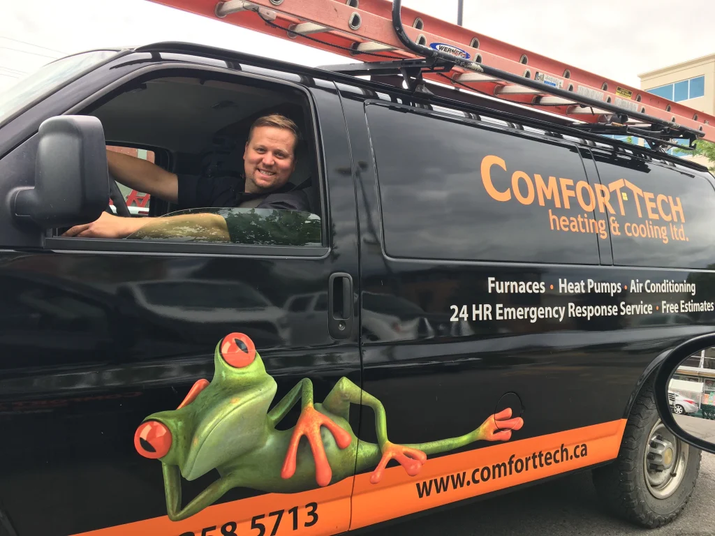 Comfort Tech worker driving their van