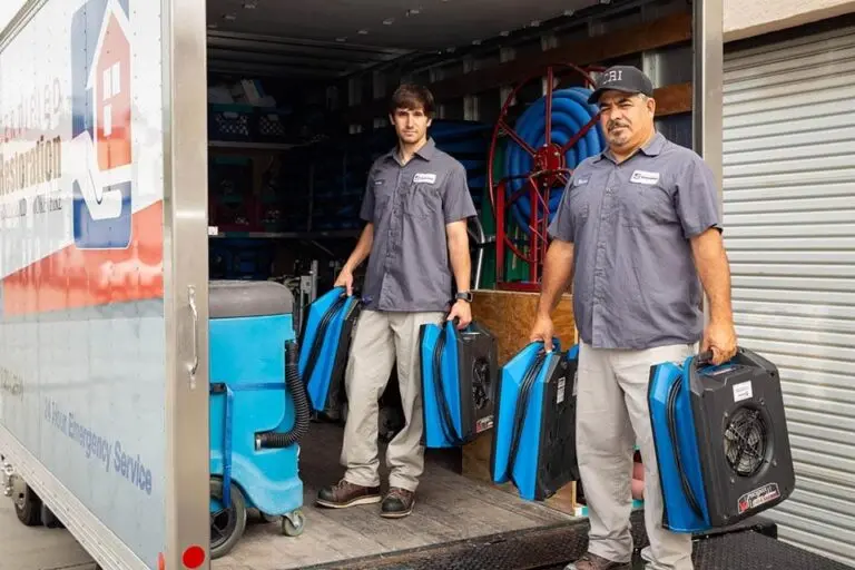 Technicians with restoration equipment