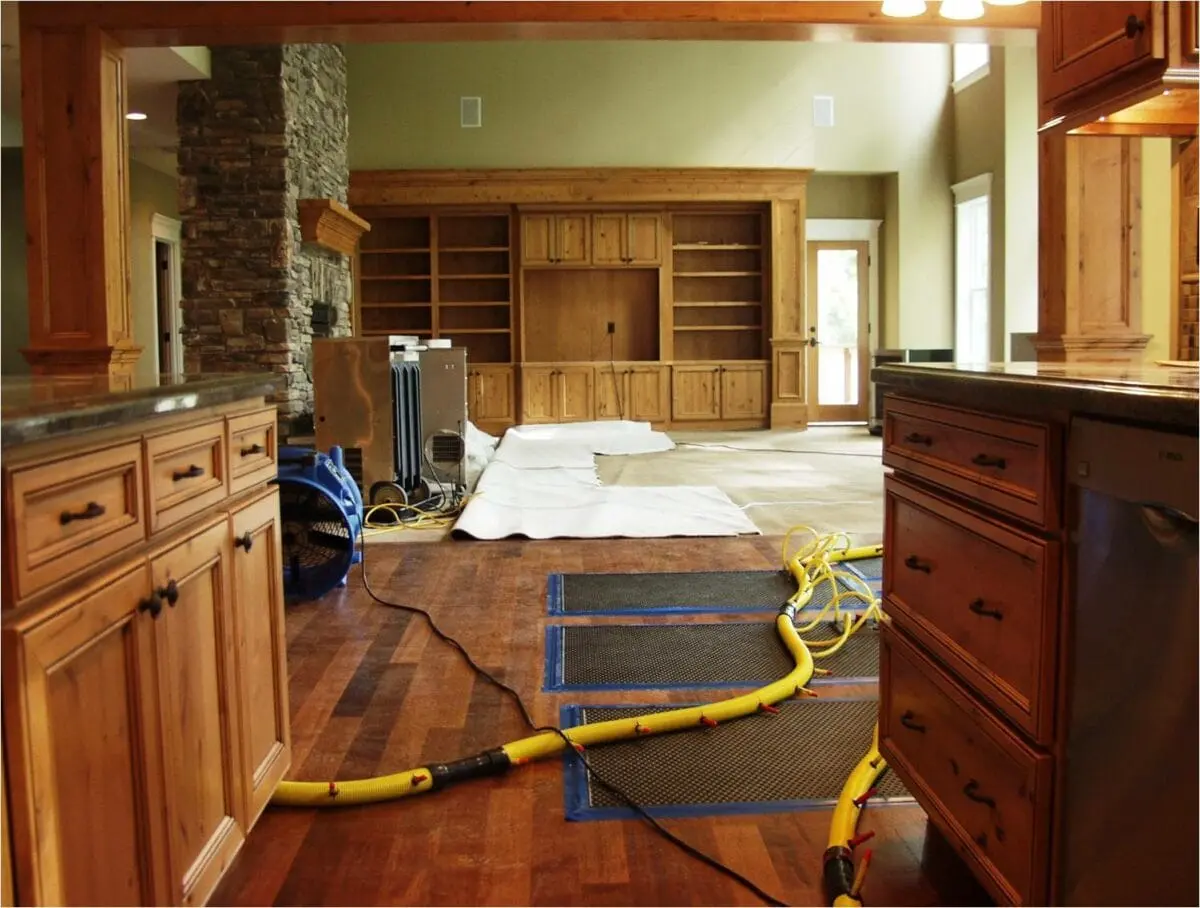 a room with a large wood floor and a large yellow hose