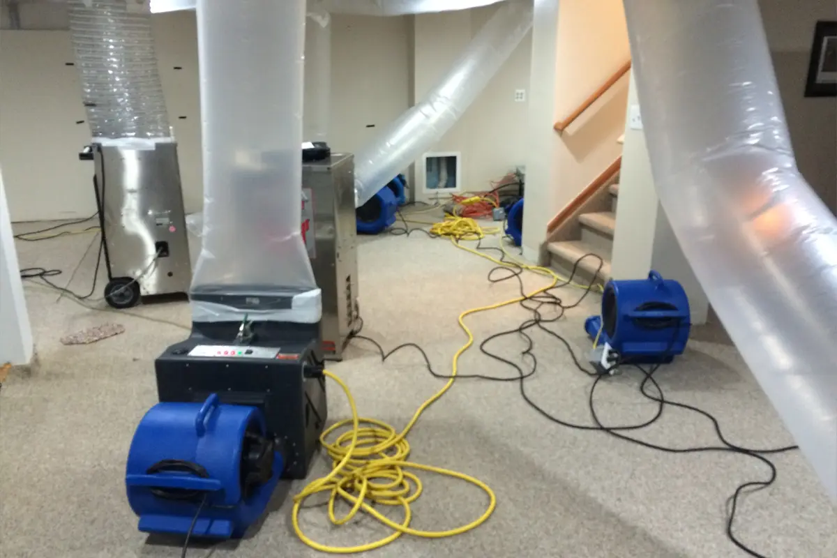 a room with several air ducts and a machine