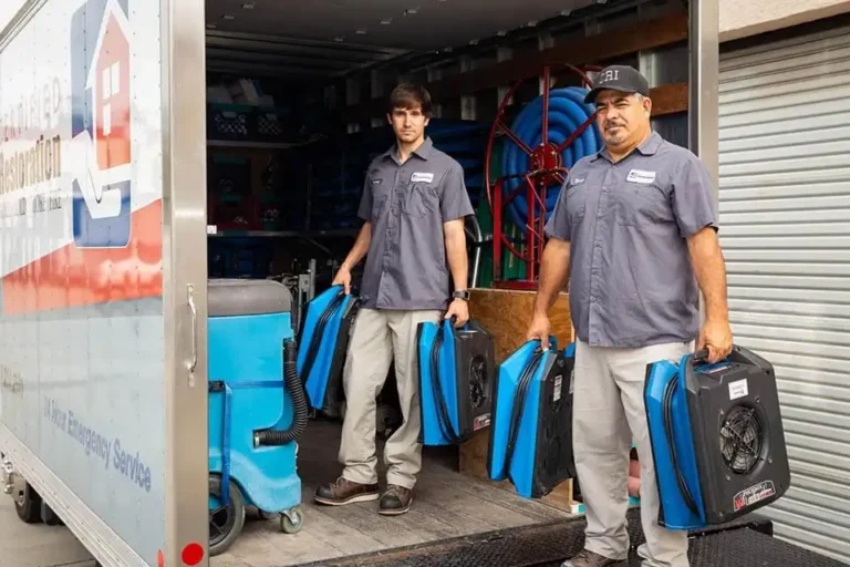 Technicians with restoration equipment