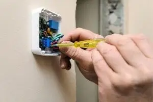 technician fixing a thermometer 