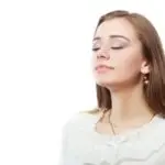 Woman enjoying fresh air, promoting healthy indoor air quality, relevant to HVAC services and maintenance tips.