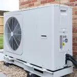 Heat pump unit installed outside a home, showcasing HVAC technology relevant to heating and cooling services offered by Mid Florida A/C in DeBary, FL.