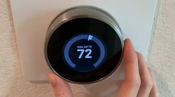 Smart thermostat display set to 72 degrees, illustrating modern HVAC technology for energy efficiency and home comfort.