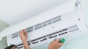 Ductless mini split system installation and maintenance by Mid Florida A/C technician.