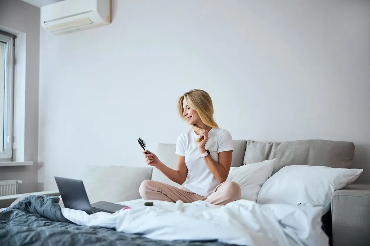 a woman enjoying air conditoning