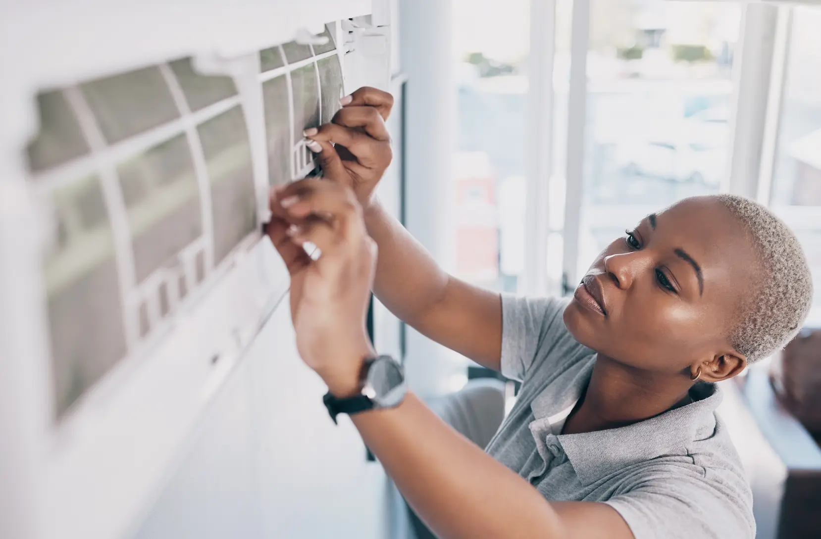 woman installing mini split ac