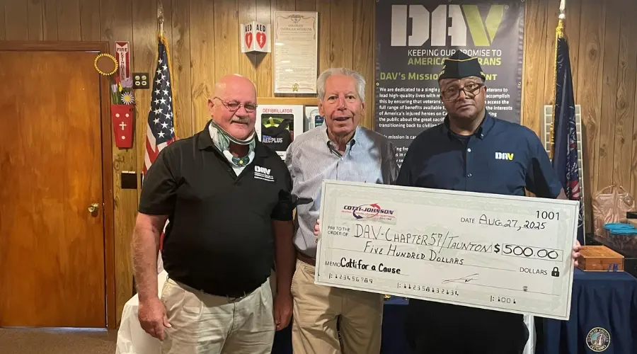 Cotti Johnson representatives presenting a $500 donation check to Disabled American Veterans (DAV) members, highlighting community support through the Cotti for a Cause initiative.
