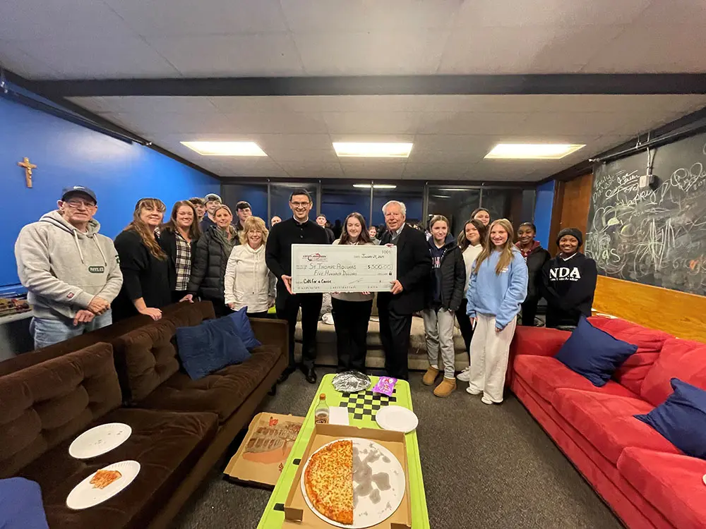 Cotti-Johnson donated $500 to St. Thomas Aquinas Youth Group