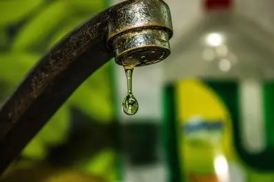 Dripping faucet with water droplet, highlighting plumbing issues relevant to homeowners in Minnetrista.