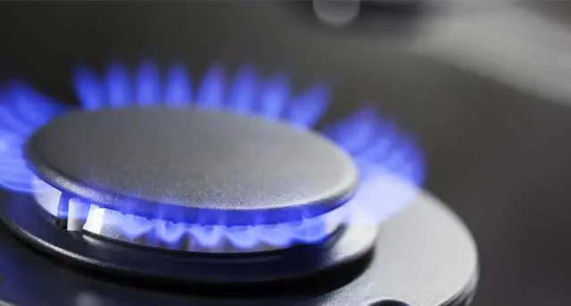 Gas burner with blue flames, representing safe and efficient gas line services by Jim Wagner Plumbing, Inc. in Darien, IL.