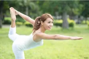 woman doing yoga in the park