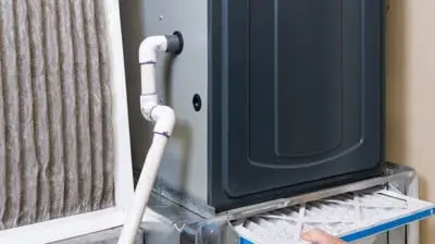 Furnace with visible air filter and maintenance access, emphasizing HVAC service and upkeep for optimal performance.