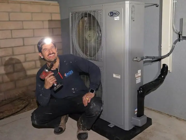 AQS Heating & Air Conditioning technician servicing an HVAC system in Hemet, California, ensuring optimal indoor air quality.