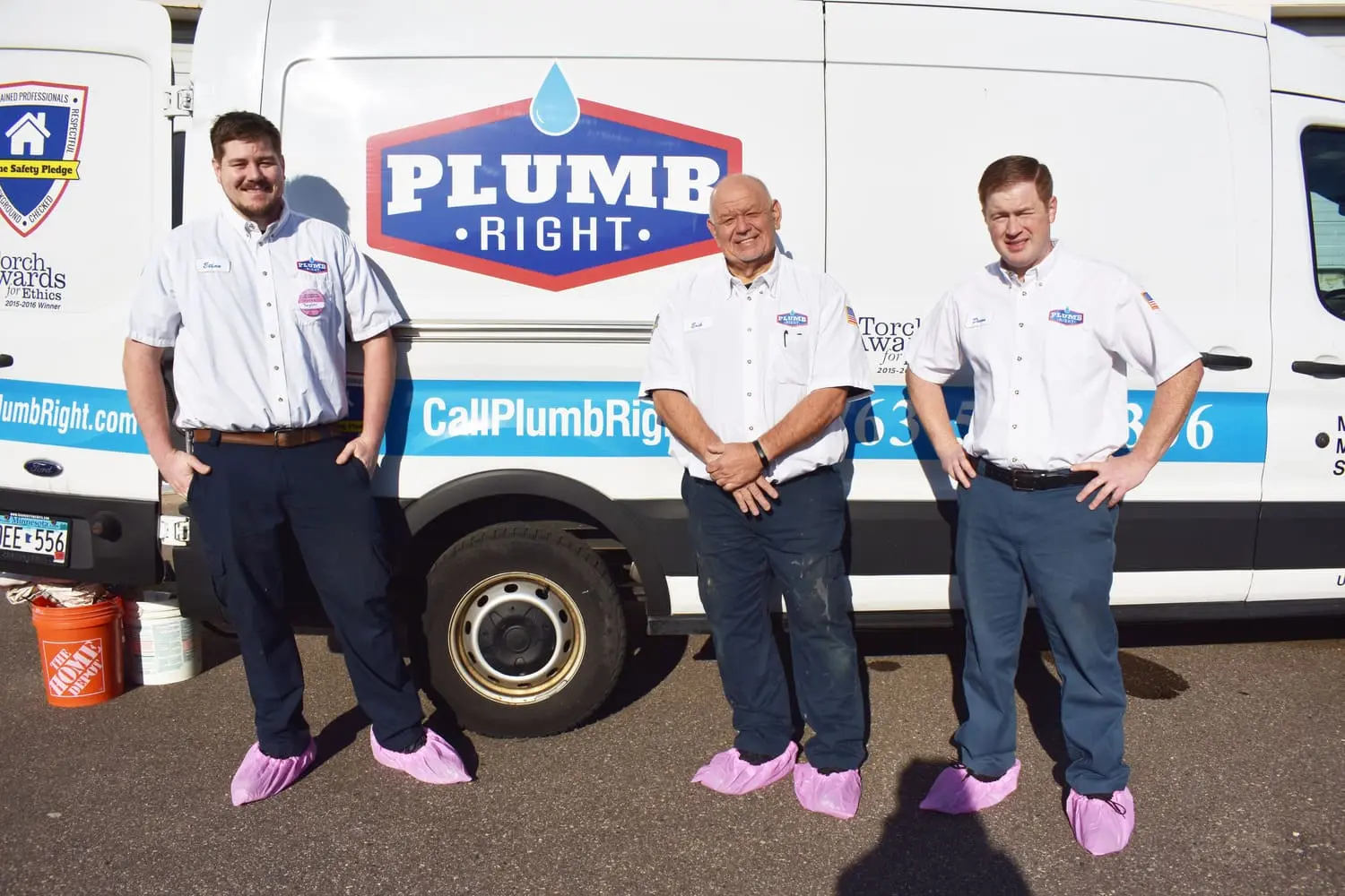 Plumb Right pink shoe covers supporting Breast Cancer Awareness