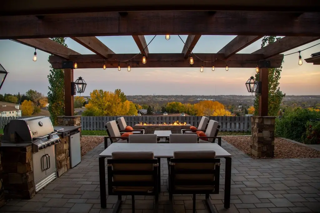 Backyard patio with and outdoor kitchen and string lights