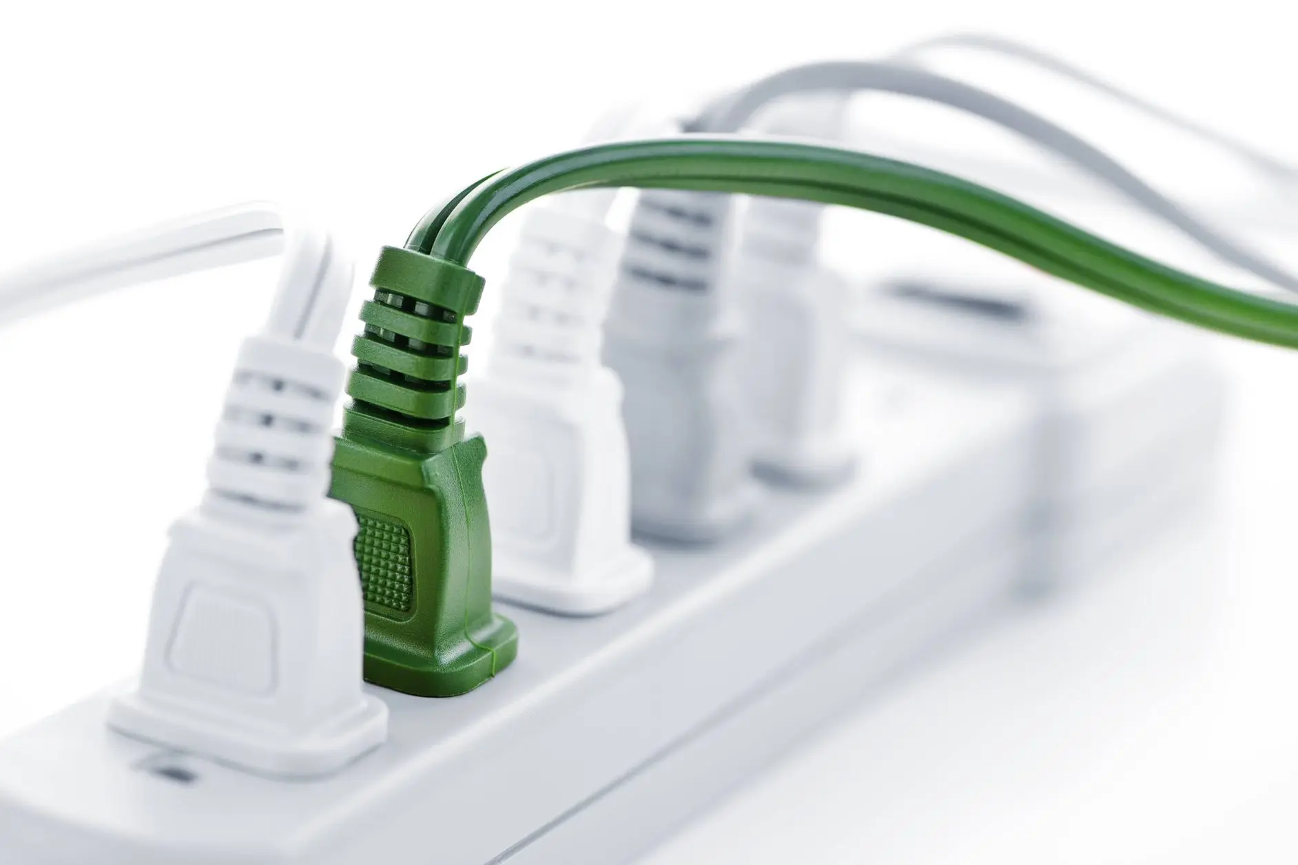 Power strip with connected cords, featuring a green eco-friendly cord for electrical safety.
