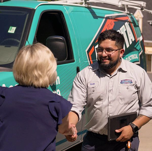 Technician from Acosta Heating, Cooling & Electrical shaking hands with a customer in front of a branded service van, emphasizing personalized HVAC service and customer satisfaction.