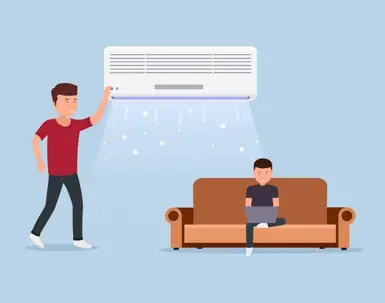A flat illustration of a man turning on a wall-mounted mini-split air conditioner that blows cool air over a person sitting on a sofa using a laptop.