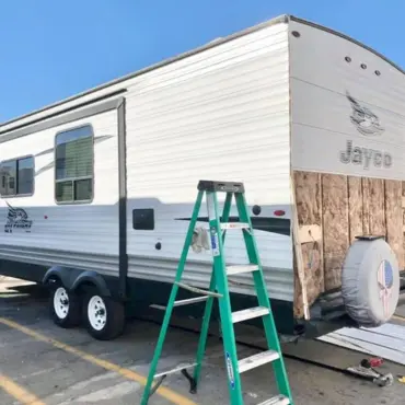 RV body repair in progress with siding removed at Arizona RV Service