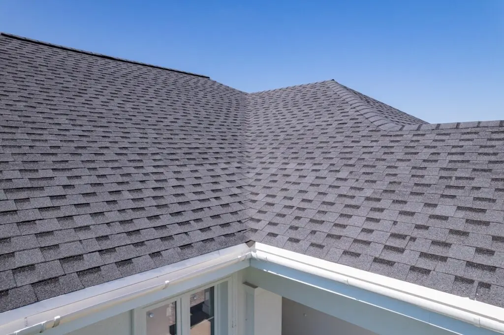 Close up view on asphalt roofing shingles - asphalt shingles roof cost