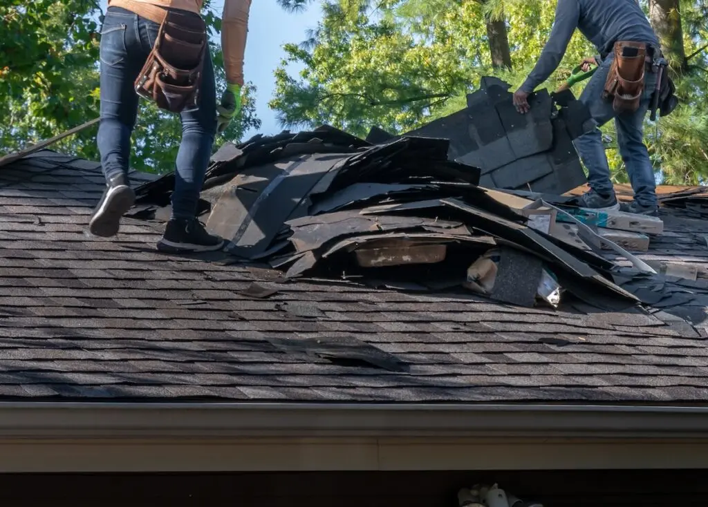 Removing storm damaged roofing