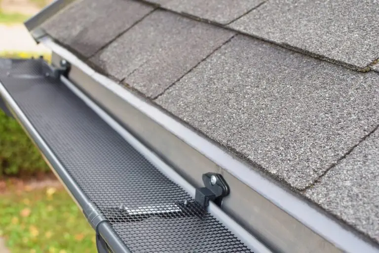 Mesh gutter guard protects gutter from debris