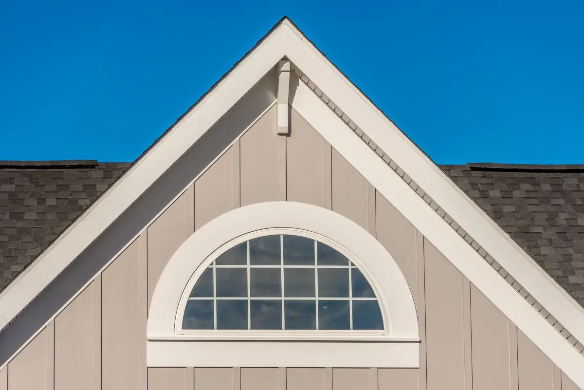 board and batten siding grey shingles roof white edges