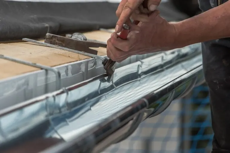 Close-up of a newly installed gutter on a roof