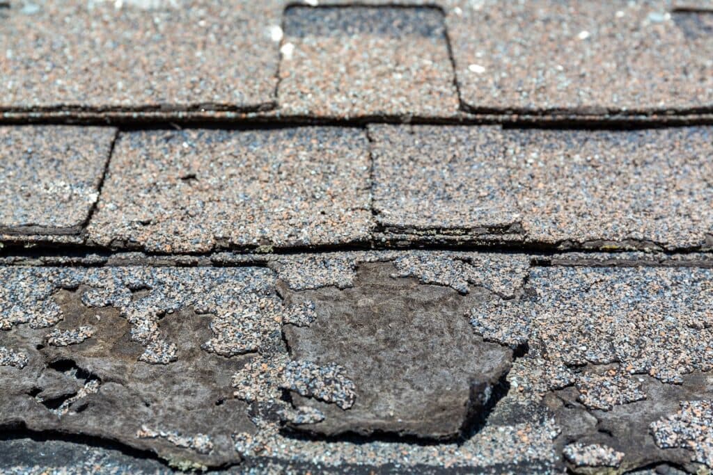Close view of sun damaged shingles.
