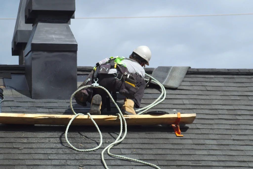 contractor does roof repairs on steep rooftop