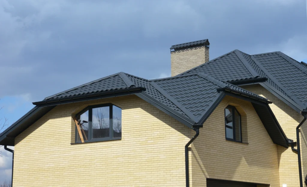 dark metal roofing material installed on new rooftop