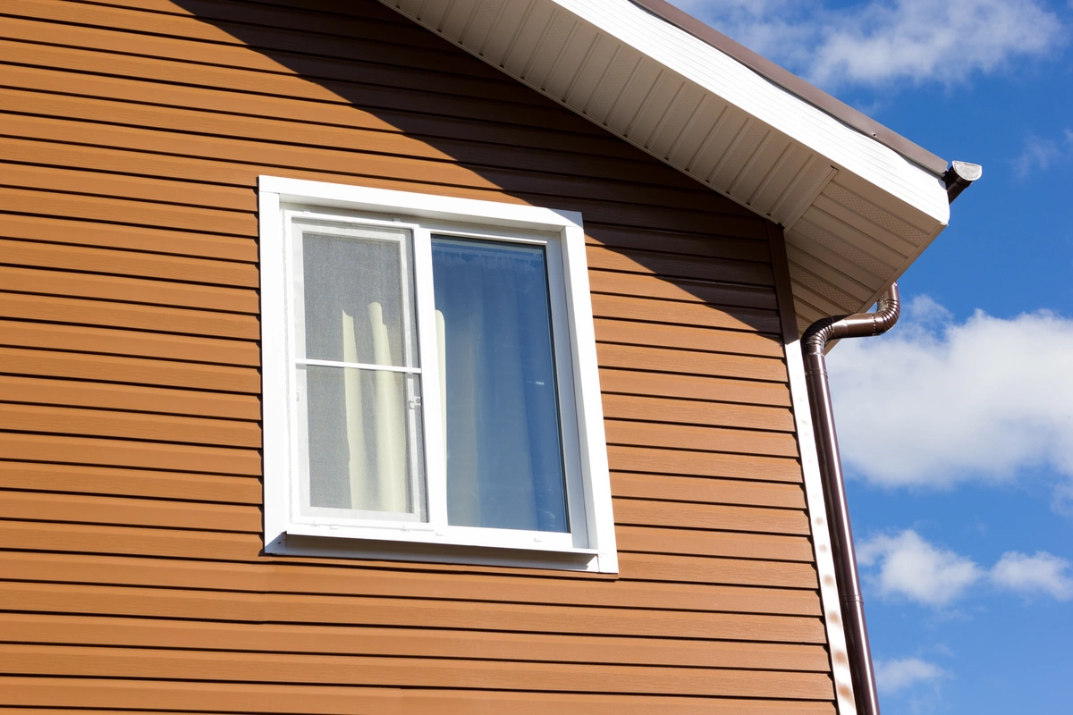 side of the house view with brown siding