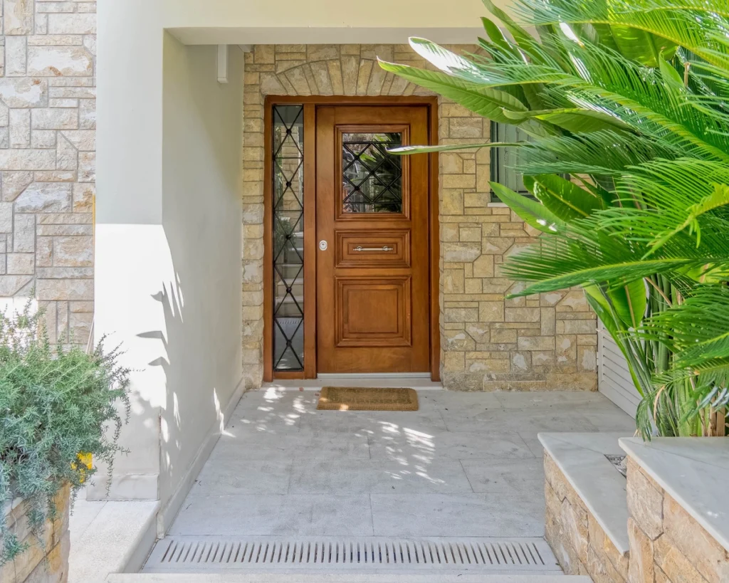 Front door with a modern portico