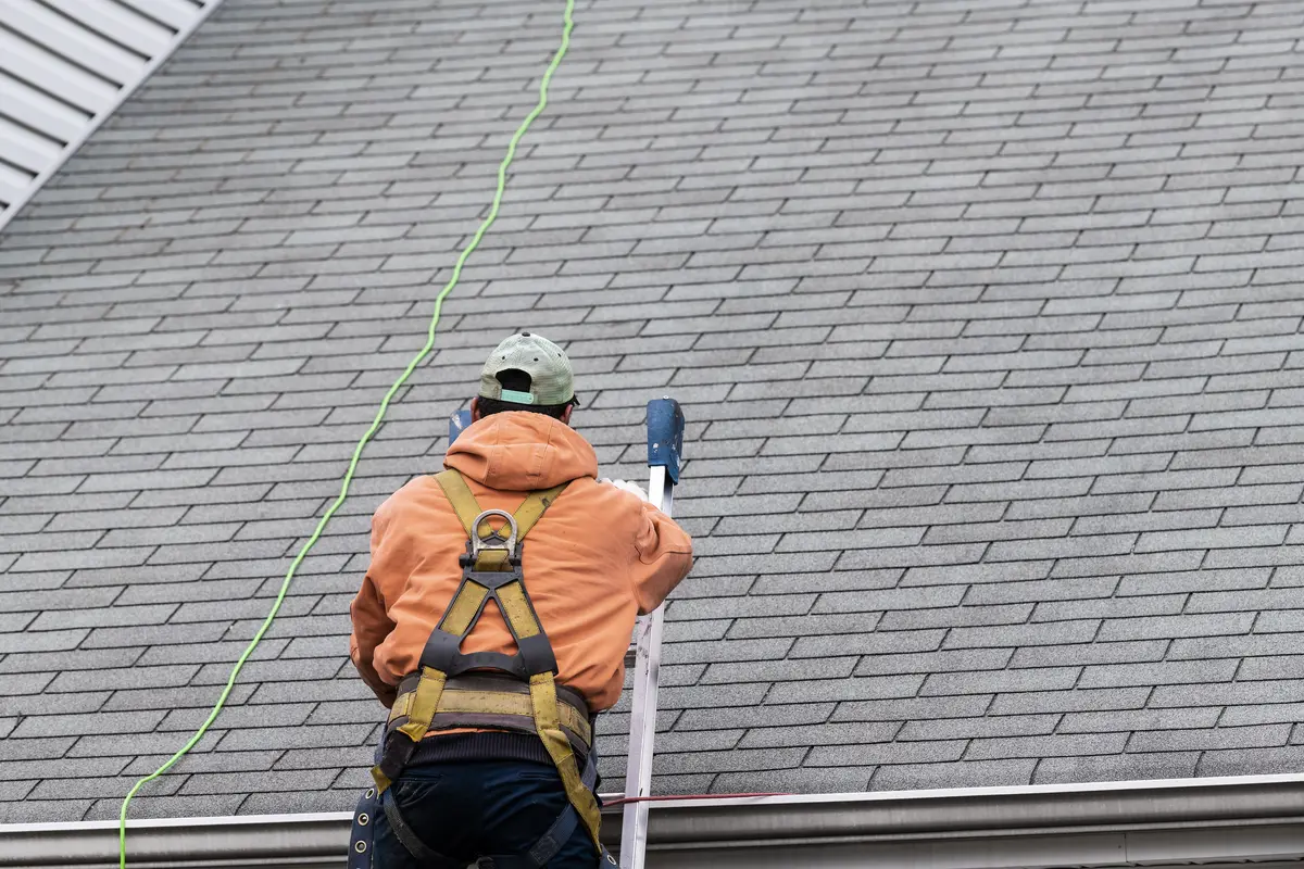 roof inspector on roof
